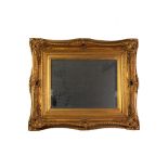 MODERN SWEPT GILT FRAMED BEVELLED MIRROR, 25 1/2" x 21 1/2" (65 x 54.4cm)