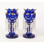 PAIR OF MODERN BLUE GLASS TABLE LUSTRES, each of typical form with flared and shaped tops,