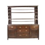 EIGHTEENTH CENTURY OAK DRESSER WITH PLATE RACK , the open back plate rack with moulded cornice above