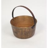 AN ANTIQUE BRASS JAM PAN, with fixed iron handle
