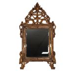 A NINETEENTH CENTURY POSSIBLY ITALIAN CARVED GILT WOOD MIRROR, the replaced bevelled plate within