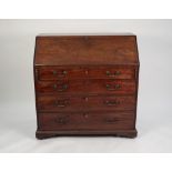 GEORGE III MAHOGANY BUREAU, of typical form with four graduated and cockbeaded drawers, fitted