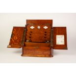 EDWARDIAN OAK STATIONERY BOX, of oblong form with sloping front with hinged top and drawer to the