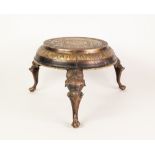 INDIAN CAST AND ENGRAVED BRASS THREE LEGGED STAND, the circular top profusely decorated with bands