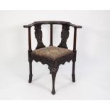 GEORGE III CARVED MAHOGANY CORNER CHAIR, of typical form, the flat top rail and splats carved with