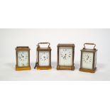 FOUR EARLY 1900's BRASS CASED CARRIAGE CLOCKS, one striking on a bell, one with missing carrying