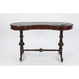 VICTORIAN CARVED MAHOGANY KIDNEY SHAPED WRITING TABLE, the crossbanded top with later faux green