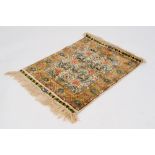 A SMALL FINELY KNOTTED SILKY PILE AND GOLD THREAD CHINESE TURKISTANI RUG, the floriated field within