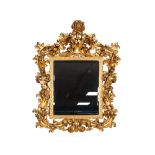 LATE NINETEENTH/ EARLY TWENTIETH CENTURY FLORENTINE STYLE CARVED GILTWOOD WALL MIRROR