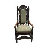 NINETEENTH CENTURY CARVED OAK OPEN ARMCHAIR IN THE SEVENTEENTH CENTURY STYLE, the padded back