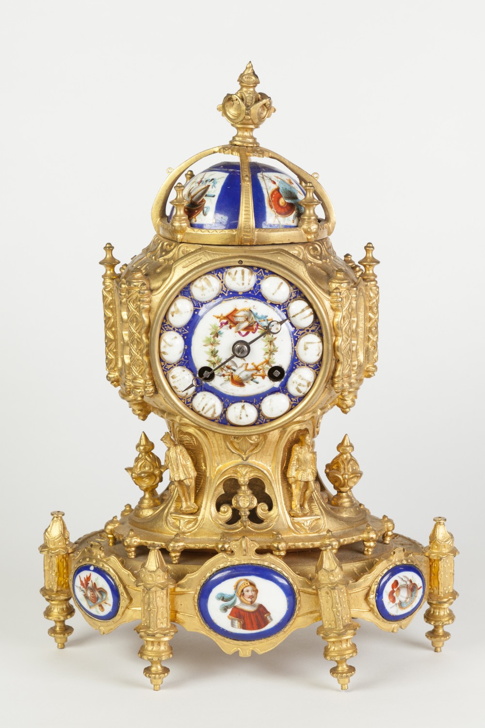 A NINETEENTH CENTURY FRENCH GILDED SPELTER PORCELAIN INSET THREE PIECE CLOCK SET, in the