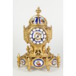 A NINETEENTH CENTURY FRENCH GILDED SPELTER PORCELAIN INSET THREE PIECE CLOCK SET, in the