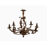 ROCOCO STYLE EIGHT LIGHT GILT METAL ELECTROLIER, with leaf capped scroll arms and pineapple finials,