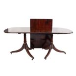 ANTIQUE MAHOGANY TWIN PILLAR DINING TABLE WITH SINGLE LEAF INSERT, having an ivorine trade label '