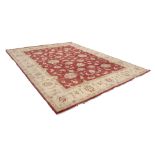 ZIEGLER INDIAN CARPET OF HERATIC PERSIAN TRAILING FORMAL FLORAL DESIGN on a deep rose pink ground,