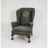 EARLY TWENTIETH CENTURY GEORGIAN STYLE WING BACK EASY ARM CHAIR, covered in green fabric with hand