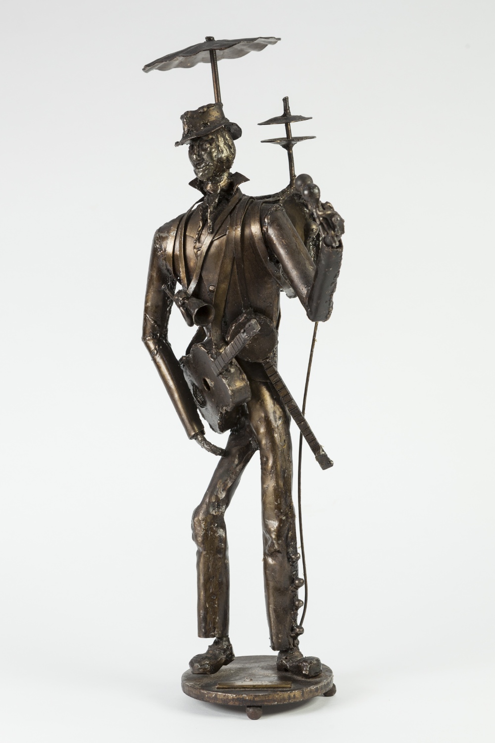 F.J. AKERS (MODERN) BRONZE PATINATED WHITE METAL SCULPTED FIGURE Entitled 'The Maestro' Applied with