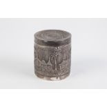 FAR EASTERN EMBOSSED SILVER COLOURED METAL CYLINDRICAL BOX WITH PULL-OFF COVER, decorated with