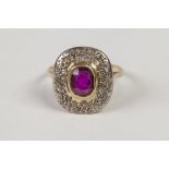 ANTIQUE GOLD COLOURED METAL RING, collet set with a centre rounded oblong ruby and pave surround