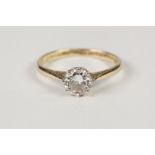 18ct GOLD AND PLATINUM RING set with a round brilliant cut SOLITAIRE DIAMOND, approximately 0.8ct,