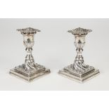 PAIR OF LATE VICTORIAN WEIGHTED SILVER DWARF CANDLESTICKS, the short baluster stems rising from