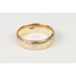 VICTORIAN 18ct GOLD BROAD WEDDING RING, foliate scroll engraved, London 1894, 6.8gms, ring size 'Q'