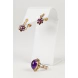 9ct GOLD RING, set with a high domed oval cabochon amethyst, 4.8gms and a PAIR OF METAL EARRINGS