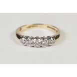 18ct GOLD RING COLLET SET WITH FIVE DIAMONDS, graduated slightly from the centre, approximately 1/