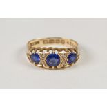 EDWARDIAN 18ct GOLD RING, set with three sapphires and two pairs of tiny diamonds, Birmingham