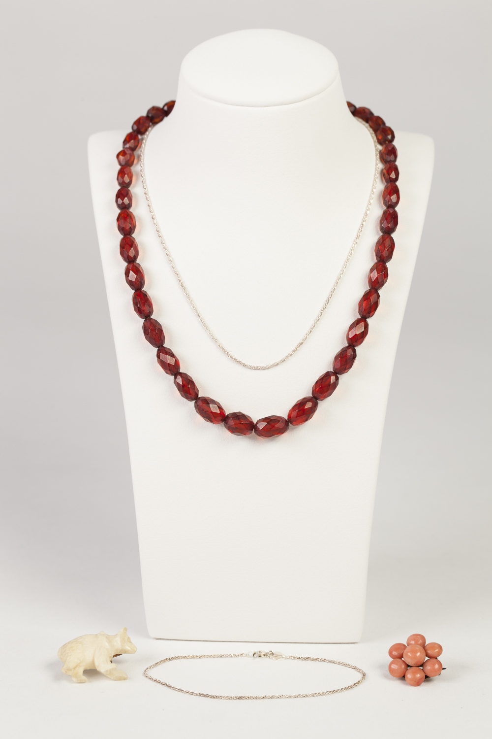SINGLE STRAND NECKLACE OF RED AMBER FACETED GRADUATED OVAL BEADS, 15" long, PINK CORAL DAISY CLUSTER
