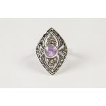 SILVER AND MARCASITE RING, the lozenge shaped top set with a round amethyst