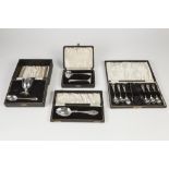 FOUR CASED SETS OF GEORGE V AND LATER SILVER CUTLERY, comprising: SET OF SIX SMALL TEASPOONS AND