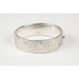SILVER BROAD HINGE OPENING BANGLE, with engraved top, Birmingham 1940
