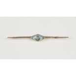 9ct GOLD PLAIN BAR BROOCH, collet set with a hexagon aquamarine, 2 1/2" wide, 2.6gms