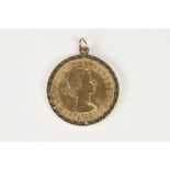 ELIZABETH II GOLD SOVEREIGN 1963, in 9ct gold loose frame as a pendant, 9gms gross