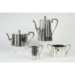 VICTORIAN SILVER TEA AND COFFEE SERVICE OF FOUR PIECES of tapered oval and fluted form with
