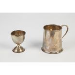 SILVER CHRISTENING MUG, of plain tapering form with scroll handle and moulded borders, 3" (7.6cm)