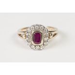 9ct GOLD, RUBY AND DIAMOND CLUSTER RING, with collet set centre oblong ruby and surround of fourteen