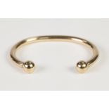 HEAVY 9ct GOLD TORQUE BANGLE, with ball pattern terminals, 32.8gms