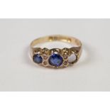 EDWARDIAN 9ct GOLD RING, set with two sapphires (one missing) and two pairs of tiny diamonds,
