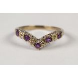 9ct GOLD RING, the 'V' shaped top set with five sapphires and four tiny diamonds, 1.9gms and a