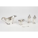 GEO V SILVER SAUCE BOAT; plain with Art Deco style angular handle rounded oblong foot, 7"(17.8)