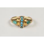 VICTORIAN GOLD COLOURED METAL RING cross set with a band of five tiny turquoises flanked by a