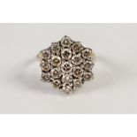18ct GOLD AND DIAMOND CLUSTER RING, with a hexagonal cluster of nineteen small diamonds, in three