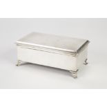GEO V SILVER CIGARETTE BOX the hinged lid with engine turned decoration and raised on out scroll