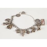 CURB PATTERN CHARM BRACELET, with ten silver charms and two padlock clasps, 1 3/4oz