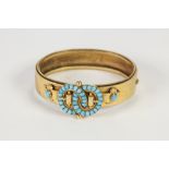 VICTORIAN (UNMARKED) GOLD BROAD HINGE OPENING BANGLE, the top with applied double buckle pattern top