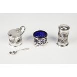 THREE SILVER SIMILAR CONDIMENT RECEIVER, pierced cylindrical, each with a blue glass liner, viz