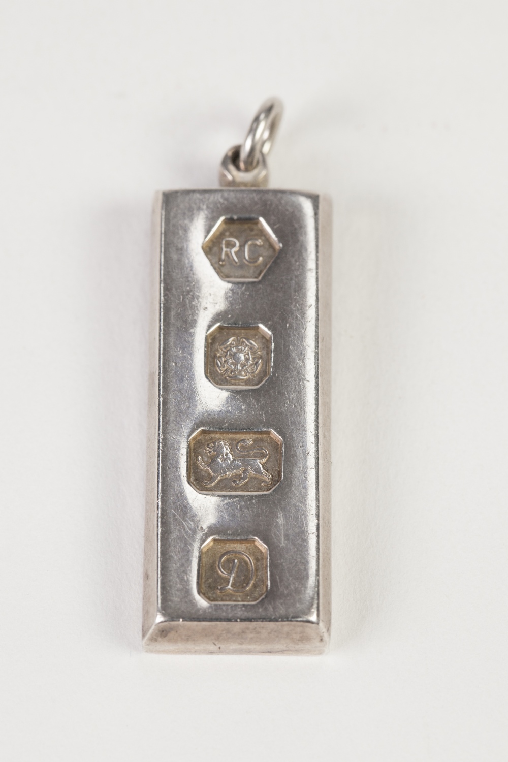 SILVER 1OZ INGOT PENDANT, with large Sheffield hallmarks for Sheffield 1978