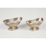 PAIR LATE 19TH CENTURY GEORGIAN STYLE SILVER OVAL PEDESTAL SALTS with semi gadroon decoration and